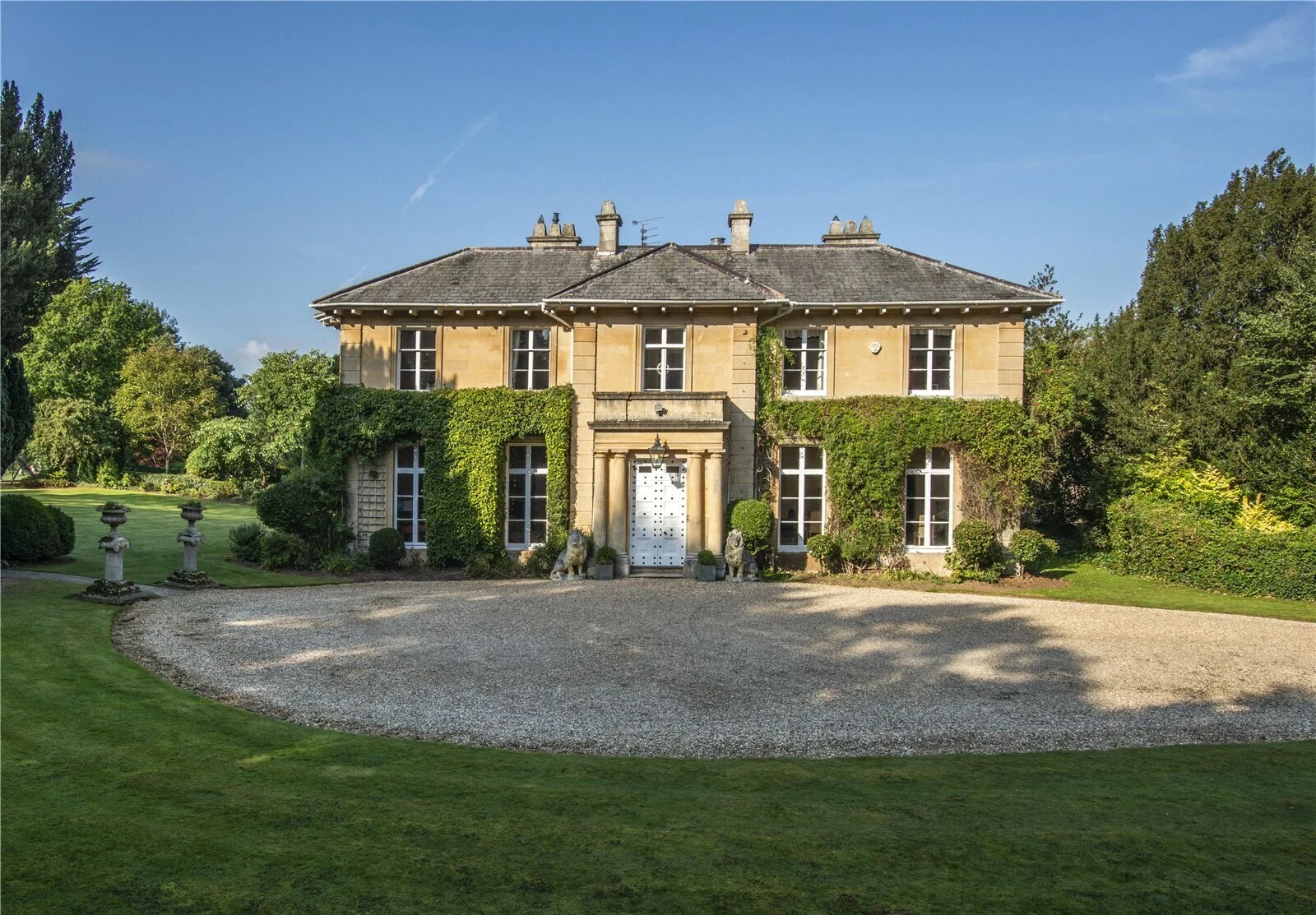 A honey-coloured Cotswold stone country house